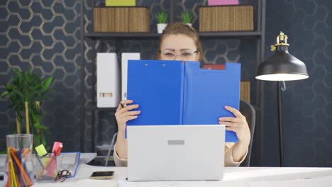 Cheerful-business-woman-working-on-files.
